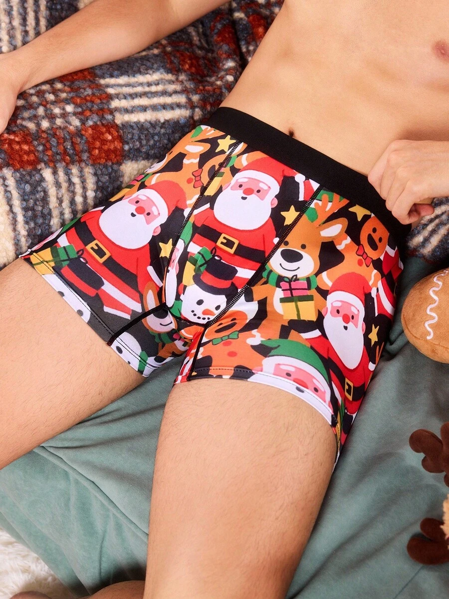 Weihnachtliche Boxershorts mit witzigem, cartoonhaftem Muster von Weihnachtsmann, Geschenkbox, Zuckerstange, Glocke, Schneeflocke, Schneemann, für Familienpartys