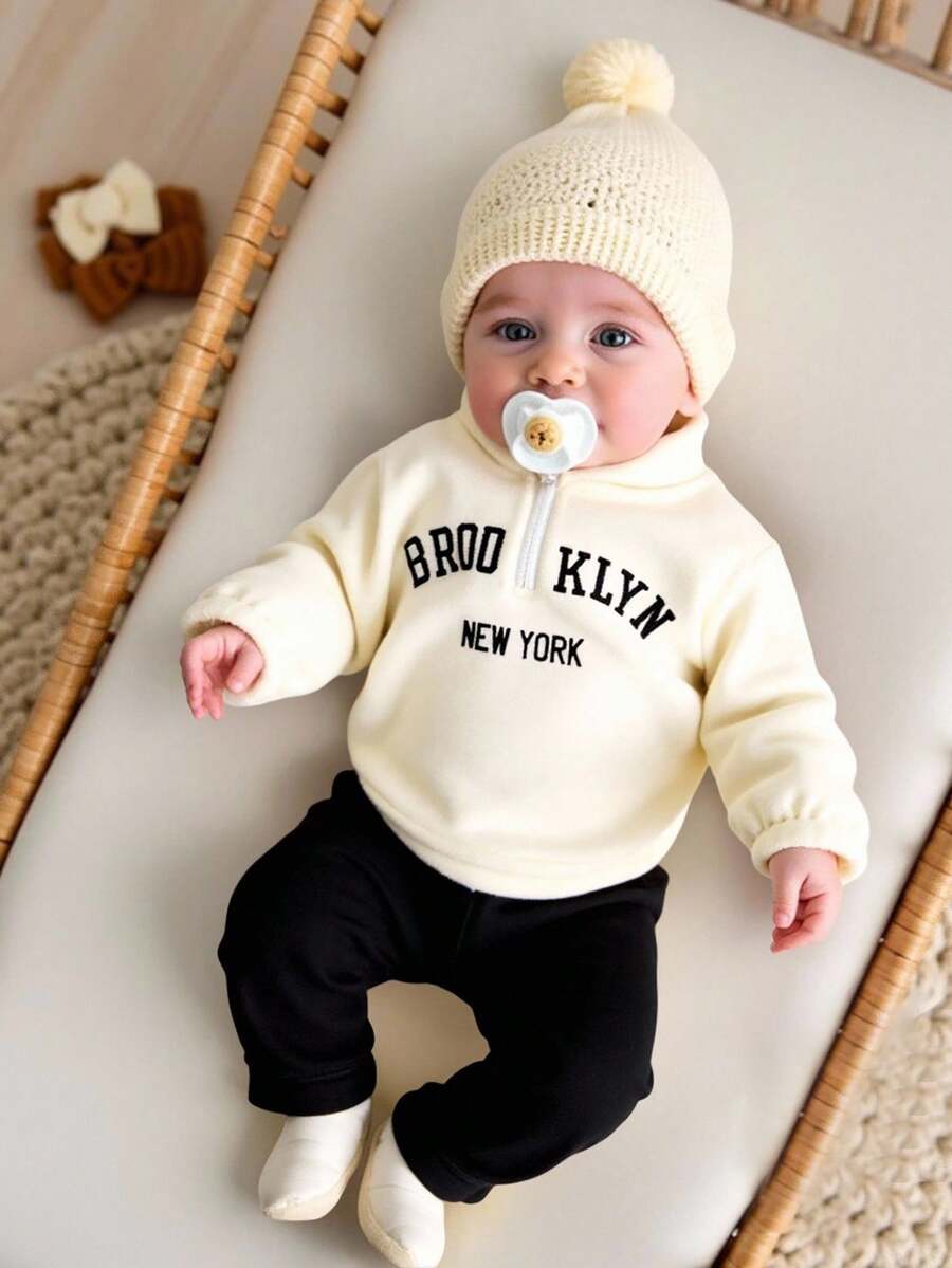 SHEIN Bộ đồ thu đông 2 món cho bé gái sơ sinh, áo dài tay cổ đứng, hở nửa phía trước, thêu họa tiết tiếng Anh, vải nỉ, quần legging đen thường ngày, trang phục dễ thương cho trẻ sơ sinh - Nhiều màu - Xem 1