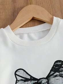 SHEIN 青少年女孩蝴蝶结印花圆领长袖运动衫和黑色迷你裙套装 - 黑與白 - 查看 7