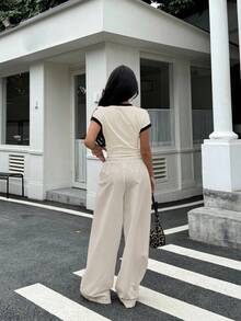 SHEIN Conjunto de dos piezas de estilo deportivo y callejero retro estadounidense para adolescentes, con camiseta de manga corta de color contrastante y pantalones anchos y holgados