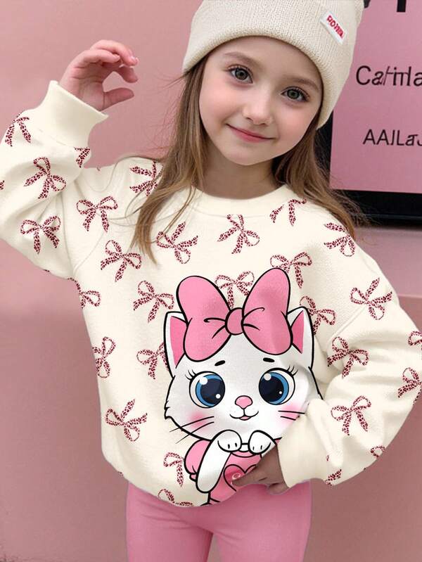 SHEIN Sudadera holgada de manga larga con cuello redondo, estampado de gato con corazón, lazo de leopardo y color blanco crema, adecuada para uso diario, Navidad, estilo callejero, hogar, vacaciones, temporada de frío, otoño e invierno, fácil de llevar, capas de otoño e invierno para niñas, ropa gráfica para niños, ropa de otoño y nuevo estilo de invierno, elegante otoño, regreso a casa