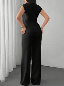 EURMUSE Two Pieces Sleeveless Knit Set Featuring Minimalist Crew Neck Top And High-Waisted Ribbed Pants In Soft Ivory - Black - View 2