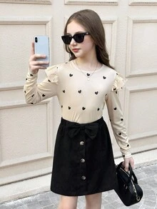 SHEIN Serisse Kids Conjunto de 2 piezas de suéter con cuello redondo y volantes con patrón de corazón tejido, y falda media con decoración de lazo de pana, estilo casual, lindo y elegante para niña preadolescente, adecuado para salidas diarias en otoño/invierno