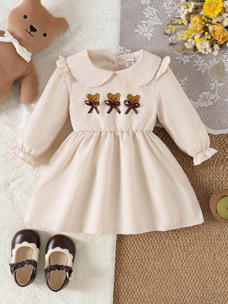 SHEIN 1 pieza Vestido beige dulce para niñas con cuello oversize, decoración de oso y lazo, vestido de princesa de manga larga, otoño/invierno