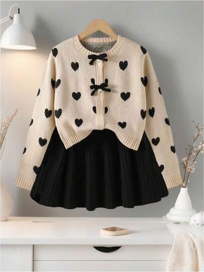 Conjunto de 2 piezas de chaqueta de suéter tejido con corazón y lazo + falda mini negra para niñas en otoño/invierno