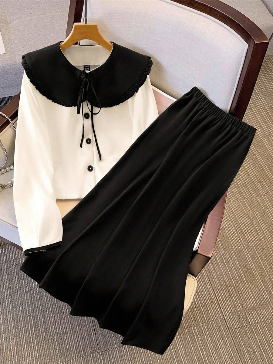 Franclia 秋冬新品：精致的套装采用黑白对比色梭织面料制成，包括迷人的彼得潘领大衣，配有精致的领结细节和优雅的黑色长款中裙 - 黑與白 - 查看 1