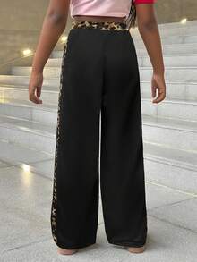 SHEIN Quần ống rộng dáng suông phối màu tương phản, cạp chun có dây rút, họa tiết báo đốm, thích hợp cho bé gái tuổi teen đi học. Phù hợp cho mặc hàng ngày, phong cách đường phố, mặc ở nhà trong dịp Giáng sinh. Quần thể thao ống rộng phong cách Y2K, thích hợp cho năm mới, mặc hàng ngày, các dịp lễ hội, mùa thu và mùa đông, mang lại sự thoải mái dễ chịu, có thể phối nhiều lớp, rất thời trang. - Nhiều màu - Xem 2