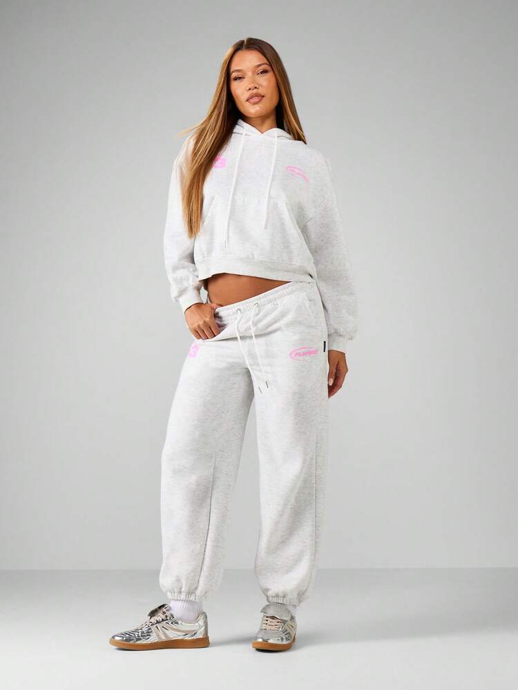 Missguided x Playboy Comfortable Heathered Motorsports Graphic Cuffed Joggers With Pink Racing Car Print And Logo