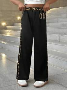 SHEIN Quần ống rộng dáng suông phối màu tương phản, cạp chun có dây rút, họa tiết báo đốm, thích hợp cho bé gái tuổi teen đi học. Phù hợp cho mặc hàng ngày, phong cách đường phố, mặc ở nhà trong dịp Giáng sinh. Quần thể thao ống rộng phong cách Y2K, thích hợp cho năm mới, mặc hàng ngày, các dịp lễ hội, mùa thu và mùa đông, mang lại sự thoải mái dễ chịu, có thể phối nhiều lớp, rất thời trang. - Nhiều màu - Xem 3