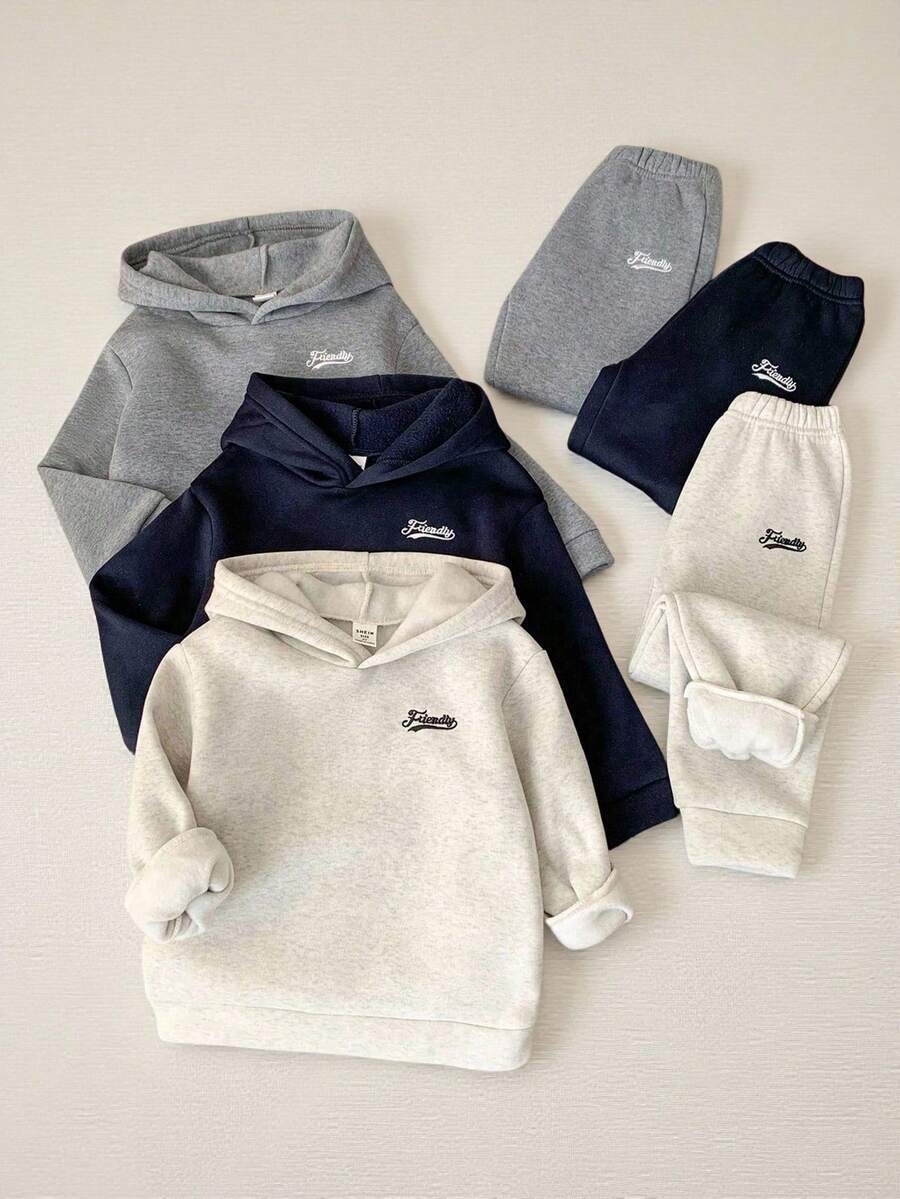 SHEIN Genkimix Kids Multi-Piece Young Boys Casual Versatile Letter Embroidered Drop Shoulder Loose Hoodie And Soft Relaxed Cuffed Pants Set. This Set Features A Simple Yet Fashionable Hooded Design To Keep Ears Warm, A Relaxed Fit For Comfort, And Soft, Skin-Friendly Fabric To Provide Healthy Care For Your Little One. It Is Very Versatile For Daily Wear, Outdoor Play, Gatherings, And Campus Styles In The Winter. - Multicolor - View 1
