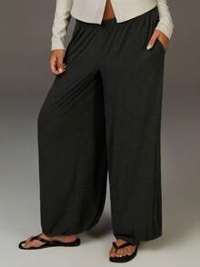 Athîral Pantalones de pierna de barril de color gris grafito oscuro para mujer, de tela de punto elástica suave, cintura media-baja con ajuste relajado, puños elásticos, construcción minimalista estilizada, detalles de dobladillo recogido sutil, confort y calidez avanzados, elegante y estilo intelectual de cápsula para otoño e invierno, pantalones fluidos para mujer, otoño para mujer, Año Nuevo, casual para mujer - Gris - Ver 2