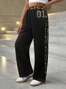 SHEIN Quần ống rộng dáng suông phối màu tương phản, cạp chun có dây rút, họa tiết báo đốm, thích hợp cho bé gái tuổi teen đi học. Phù hợp cho mặc hàng ngày, phong cách đường phố, mặc ở nhà trong dịp Giáng sinh. Quần thể thao ống rộng phong cách Y2K, thích hợp cho năm mới, mặc hàng ngày, các dịp lễ hội, mùa thu và mùa đông, mang lại sự thoải mái dễ chịu, có thể phối nhiều lớp, rất thời trang. - Nhiều màu - Xem 6