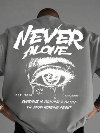 Manfinity EMRG Camiseta casual de manga corta con cuello redondo, gráfico de lema y ojo para hombres