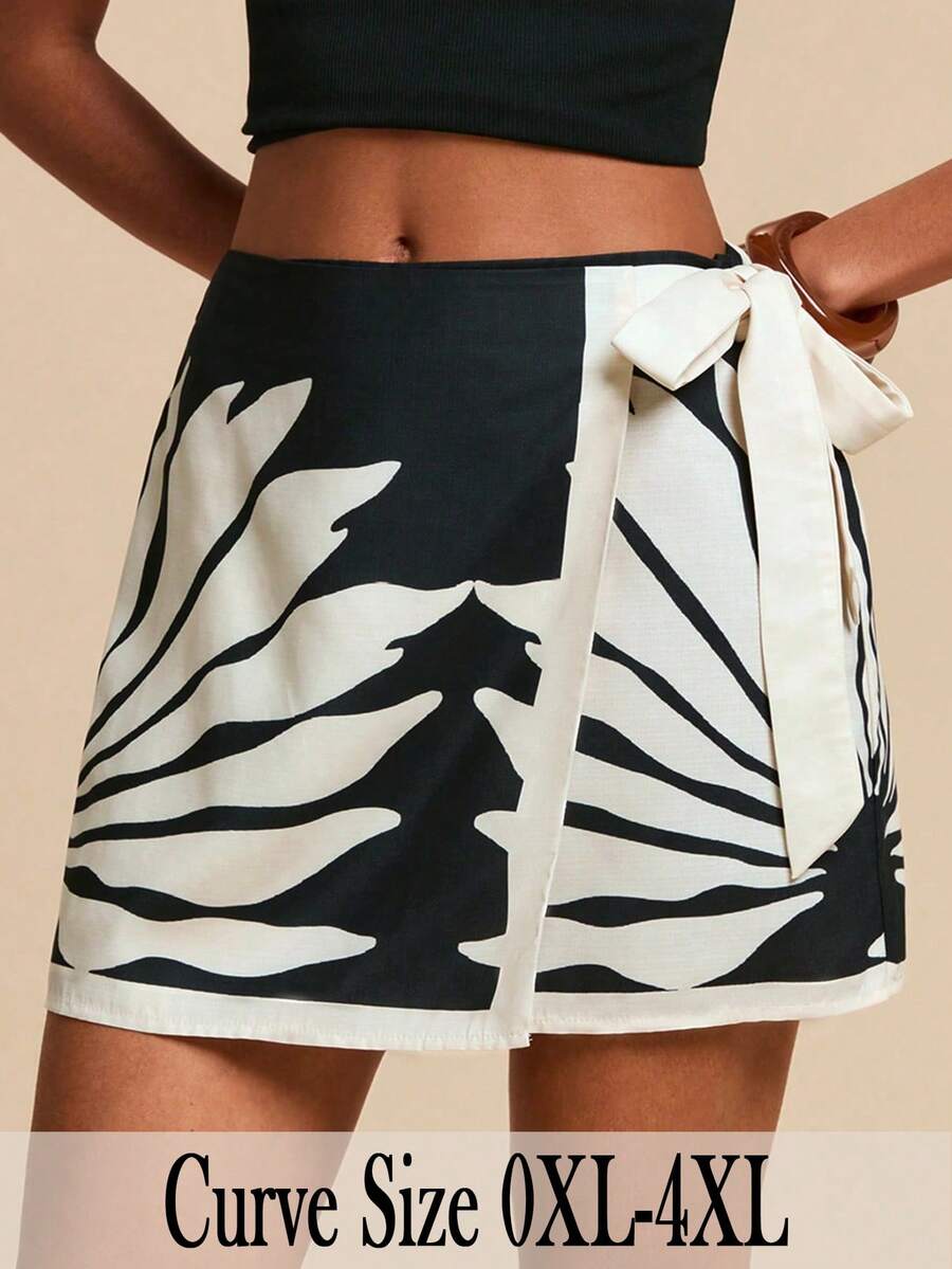 Travachic 大码女式黑白树叶剪影印花裹身系带腰半身裙，撞色拼接露脐交叉系带下摆沙滩黑色迷你裙 - 黑與白 - 查看 1