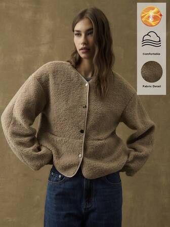 Nöista Taupe Teddy Jacket With A Relaxed Silhouette And Full Button Front; Plush Texture And Minimalist Design Provide Cozy Layering For Autumn Outings And Snug Winter Wear During The Holiday Season.