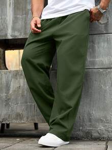 Manfinity Homme Quần dài thường ngày rộng rãi có túi rút eo màu trơn cỡ lớn dành cho nam, mùa thu - xanh quân đội - Xem 1