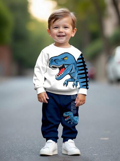 SHEIN 2 件套男童休闲宽松卡通动物、恐龙、涂鸦图案长袖运动衫和裤子运动套装，适合夏季穿着舒适