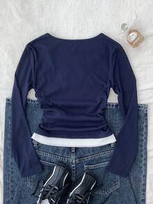 Tween 女童海军蓝和白色拼接腰部褶饰贴身小徽标图案长袖针织休闲 T 恤