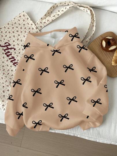 Sudadera de cuello redondo cómoda de punto de manga larga con estampado de lazos, corte holgado y casual para niñas, adecuada para otoño/invierno