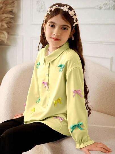 Tween flickors långärmade enkelknäppta skjorta med rosettdekoration