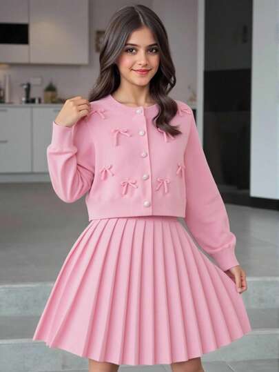 Sparklyn Tween Girls Sweater Set, Pink Round Neck Button Long Sleeve Handmade Bow Knit Sweater + Matching Color Pleated Mini Skirt, Loose Fit, Soft & Comfortable, Suitable For Spring/Autumn, Daily, Outdoor, Travel, Vacation, Home, And Kids Play Fall Winter Skirt And Jacket Set Pink Skirt Set Valentines Day Pink Outfit Pink Skirt Set Girls