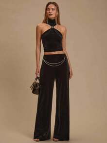 SHEIN Glamour A Sexy Black Velvet Ensemble Featuring A Backless Top Adorned With Irregularly Shaped Decorative Rings, Paired With Trousers Featuring Long Copper Flat-Pressed Chains Combined With Lobster Clasps. Women's Clothing Sets, Sexy Party Dresses, Festive Clothing Sets, Carnival Attire, Cocktail Party Clothing Sets, Two Pieces Sets, Sexy And Alluring Girls, Women's Beachwear.