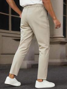 Manfinity Mode 男士商务休闲纯色锥形正装裤，经典米色，时尚百搭，彰显稳重端庄的商务气质。适合日常通勤、商务、聚会和宴会。这款裤子是男士衣橱中不可或缺的百搭单品，也是送给男朋友或老公的绝佳礼物。 - 米色 - 查看 2