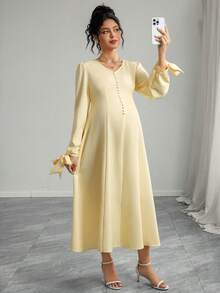 Momance 孕妇连衣裙，蝴蝶结肩带，长袖，A字型褶皱前襟，纽扣闭合，腰部系带长裙 - 黃色 - 查看 6