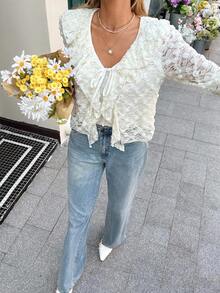 SHEIN Frenchy Camiseta de manga larga con volantes en el bajo y lazo delantero, de moda para mujer