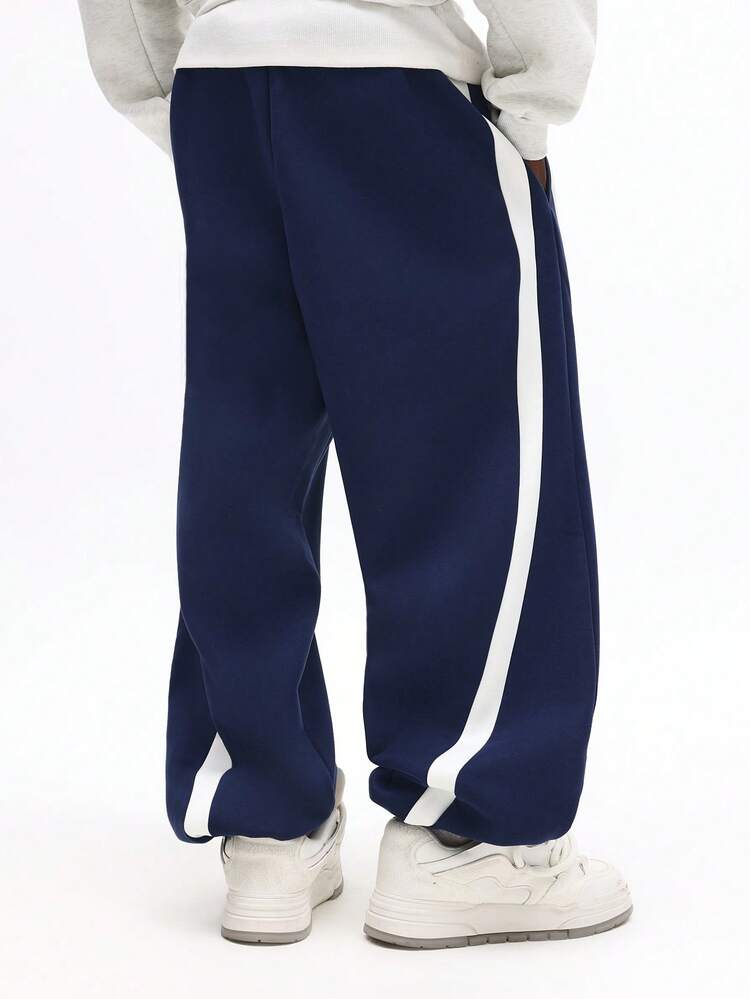 Pantaloni da jogging larghi con risvolti e pannelli laterali