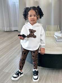 SHEIN Baby Mädchen süßes lässiges Set aus Langarm T-Shirt mit Cartoon Muster und karierter Hose