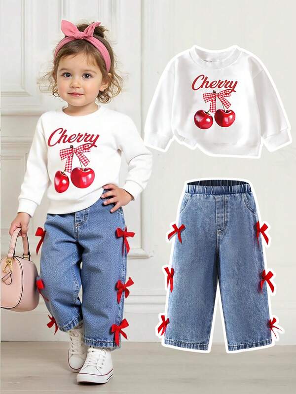 SHEIN Playful Pals 2 piezas Conjunto casual de niña bebé con estampado de cerezas: blusa de manga larga y jeans con decoración de moño, para otoño/invierno