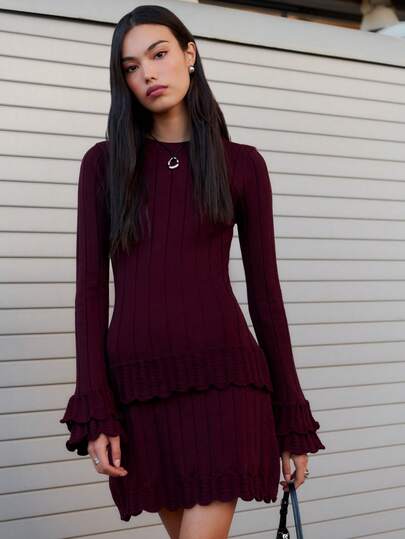Nöista This Ribbed Burgundy Dress Features Long Sleeves With Flared Cuffs And A Fitted Silhouette That Flatters The Figure. A Perfect Fall And Winter Dress For Women That Blends Warmth, Comfort, And Feminine Charm.