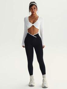 Easithlete Set de 2 piezas de ropa deportiva sin costuras para mujer, top de manga larga blanco y mallas negras