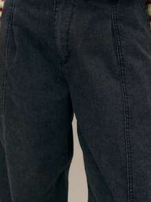 Nöista Relaxed-Fit Black Pants With A Vintage Washed Effect And Tapered Silhouette; Elasticated Cuffs And Minimal Seams Give Modern Flair For Fall Streetwear And Comfortable Winter Layering.