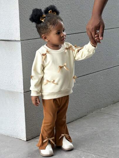 SHEIN 2pcs Infant Girl Fashionable, Elegant, Sweet & Cute Apricot Round Neck Long Sleeve Hoodie With Ribbon Bow Decor, Paired With Brown Flared Pants Set, Suitable For School, Photography And Gatherings