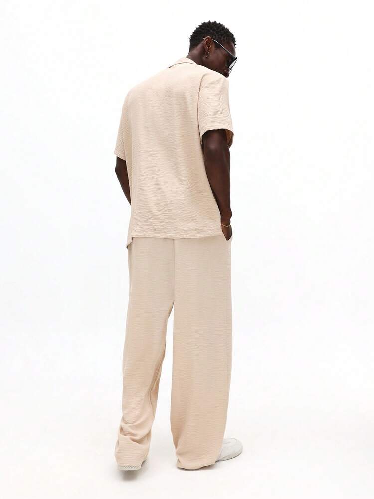 Komplet: koszula zapinana na guziki i spodnie z szerokimi nogawkami