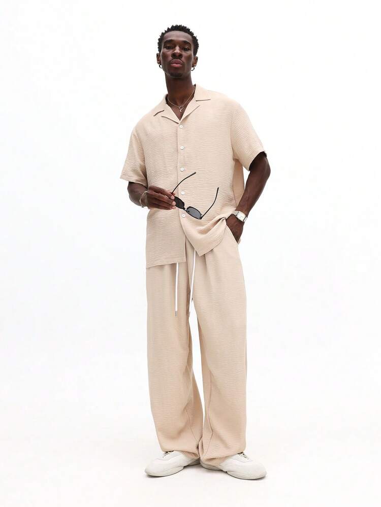 Komplet: koszula zapinana na guziki i spodnie z szerokimi nogawkami