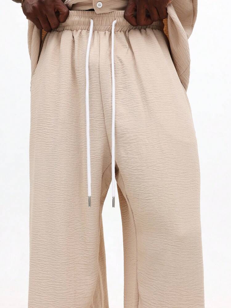 Komplet: koszula zapinana na guziki i spodnie z szerokimi nogawkami