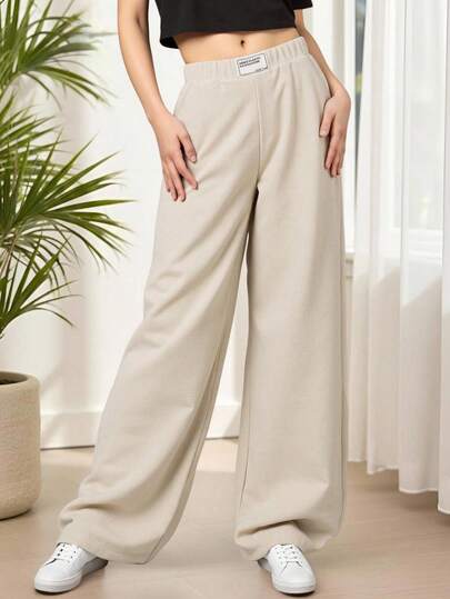 SHEIN Tween Girl 极简主义宽松垂坠阔腿裤，带提花徽标饰边