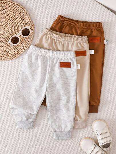 SHEIN Vintaside Kids paquete de 3 pantalones de pies de unicolor para bebé recién nacido niño/niña (negro, blanco, azul), versátiles para el hogar, juegos al aire libre, viajes y talla grande