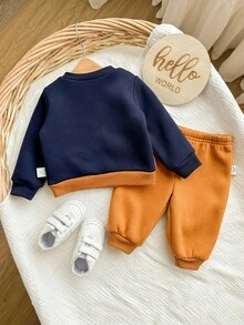 SHEIN Neugeborenen Baby Jungen süßer Farbblock Cartoon Muster Langarm Sweatshirt & Hose mit elastischem Bund Set, Herbst/Winter