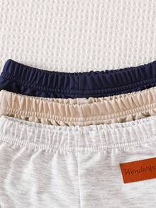 SHEIN Vintaside Kids 3-Pack Newborn Baby Boy/Girl All-Match Solid Color Footie Pants (Black, White, Blue), Versatile For Home, Outdoor Play, Travel & More, Value Pack Baby Boy Joggers Pants Baby Boys Bottoms Baby Trousers