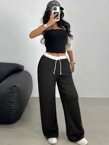 SHEIN Quần nỉ ống rộng dáng suông, cạp thấp, chun co giãn, thích hợp cho nữ tuổi teen, đa năng cho mùa xuân, hè, thu, đông. Phù hợp mặc hàng ngày, phong cách đường phố, ở nhà, ấm cúng mùa thu đông. Quần thoải mái phù hợp cho năm mới, hàng ngày, lễ hội, mùa thu đông, dễ mặc, phối đồ nhiều lớp, thời trang. - Đen và trắng - Xem 8