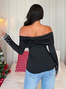 Rafferiza Camiseta de manga larga con hombros descubiertos, volantes y perlas falsas, sexy y elegante, que define la cintura, para mujer en otoño y invierno, para fiestas, Navidad - Negro - Ver 3