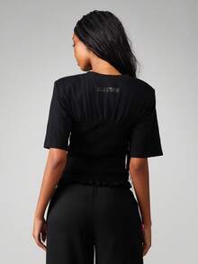 Missguided x Playboy Stay Smocked T-Shirt With Ruffle Hem And Pink Script For Casual Summer Wear - Black - View 2