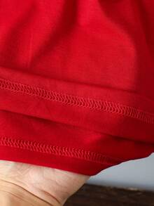 SHEIN Camiseta básica de manga corta con estampado gráfico de lazo de lunares, lema navideño y diseño de dibujos animados lindo y elegante para niña, cómoda para fiestas de Navidad y salidas