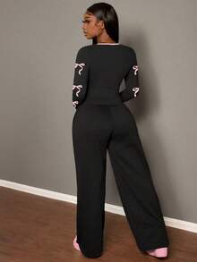 Slaydiva Bộ 2 quần thể thao ống đứng thường ngày dành cho nữ + áo phông dài tay/Dành cho mùa thu/đông/Quần áo Y2k/Thời trang dạo phố/Bộ đồ hai mảnh dành cho nữ/Trở lại trường/Thời trang dạo phố thường ngày/Phù hợp với phong cách Hip Hop/Số 07 & Họa tiết nơ - Nhiều màu - Xem 2