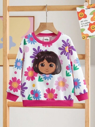 DORA | SHEIN Sudadera holgada con estampado de figura de dibujos animados de flores coloridas, con ribete de contraste, hombros caídos, para niña, otoño/invierno