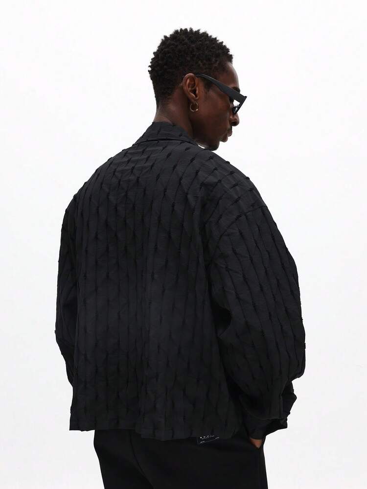 Giacca trapuntata con bottoni e motivo a rombi